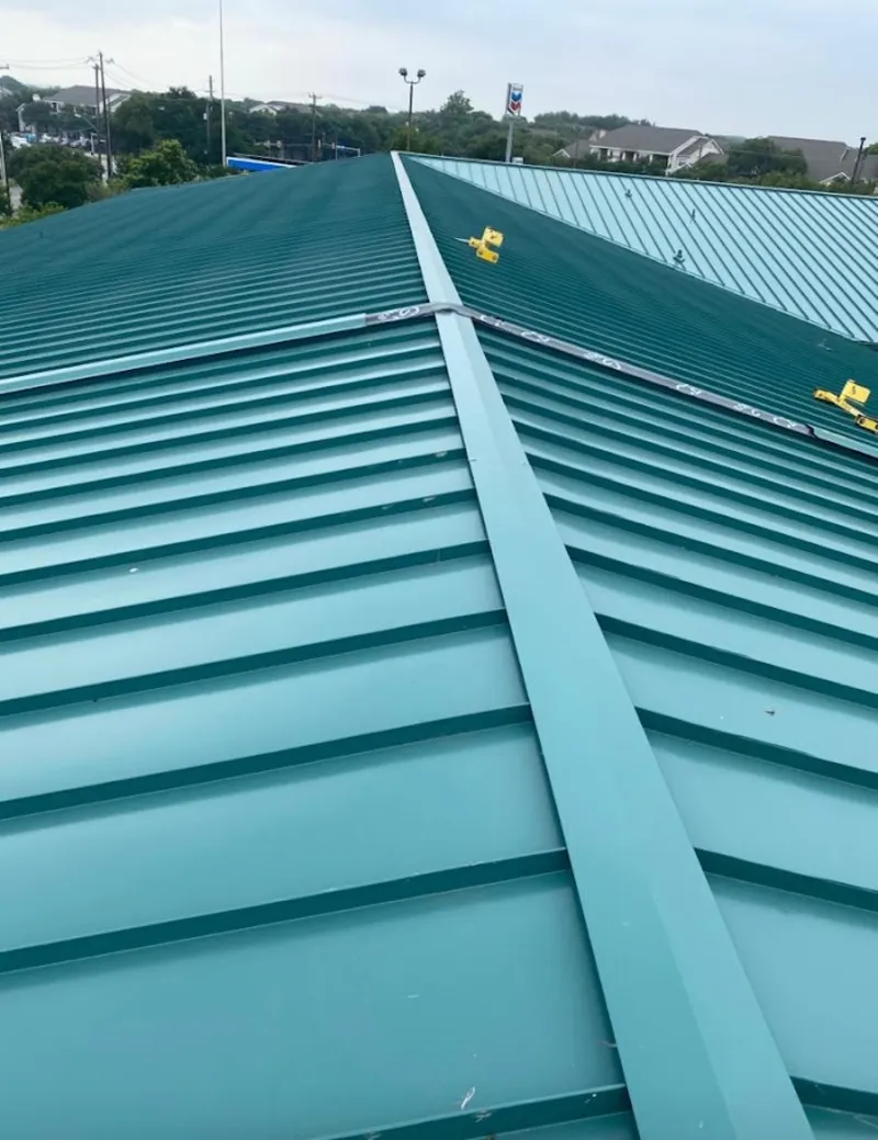 Green commercial metal roof ridge and valley for Metal Roof Repair in Sunset